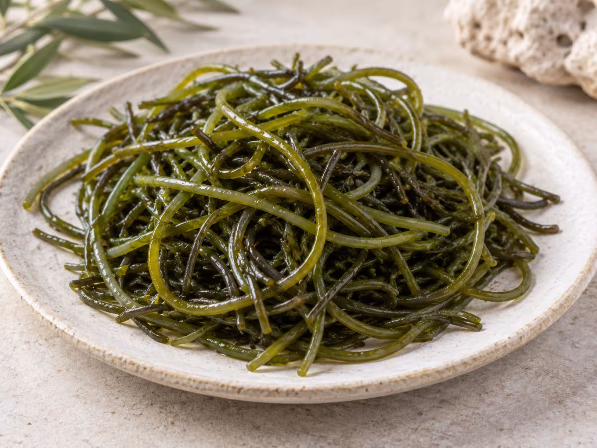 Sea spaghetti seaweed on a clean surface without packaging