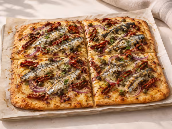 Sun-dried tomato and sardine flatbread ready to serve