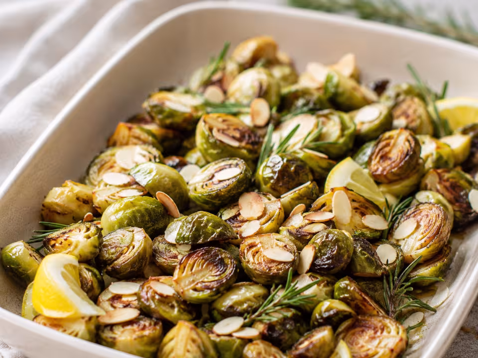Roast Brussels sprouts with rosemary and almonds plated and ready to eat