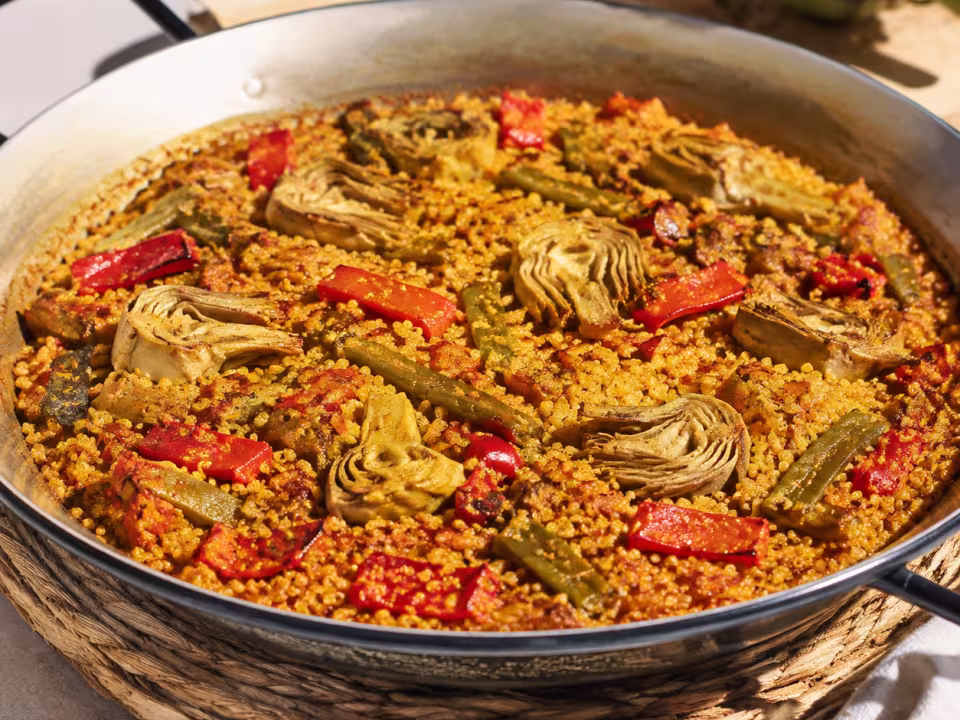 Saffron quinoa and vegetable paella plated and ready to eat