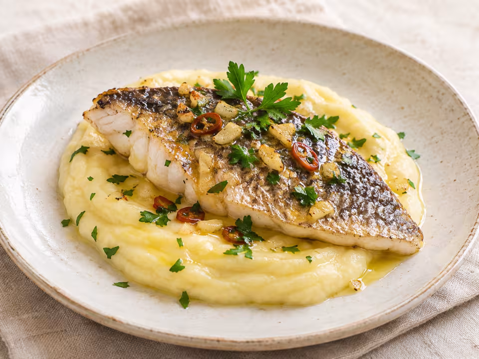 Sea bream with potato mousseline and garlic oil ready to serve