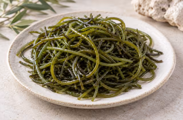 Sea spaghetti seaweed on a clean surface without packaging
